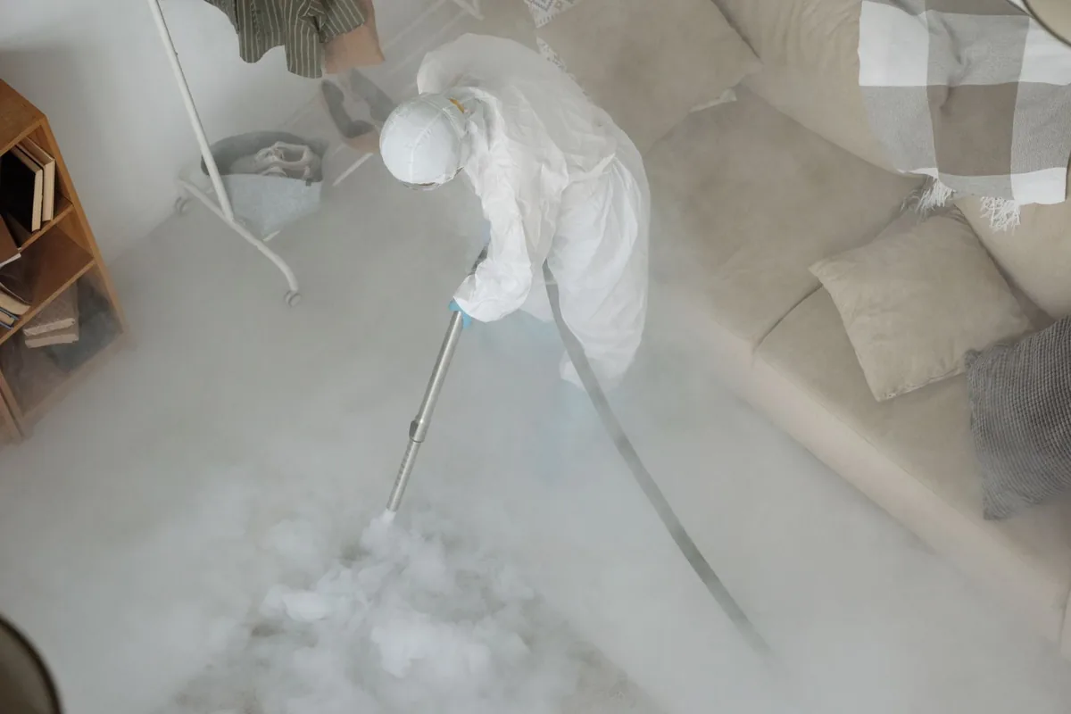 Biohazard cleanup technician in protective equipment, Ashland Ridge, Kansas City, MO
